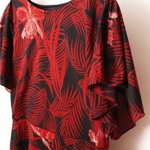 1980s vintage style dress with red, white tropical print on black background